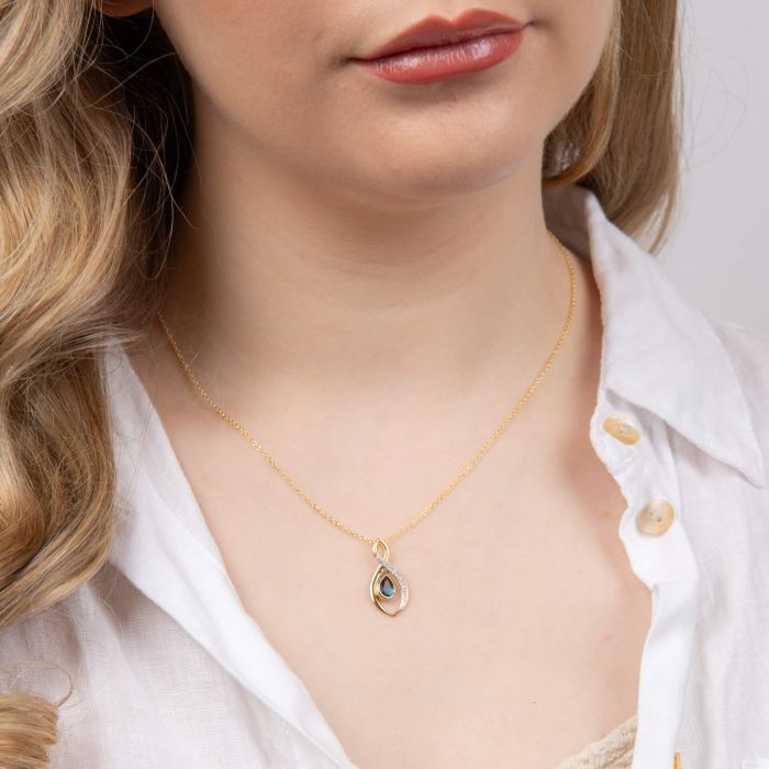 Twist Teardrop Blue Topaz Pendant with Diamond in 9ct Gold
